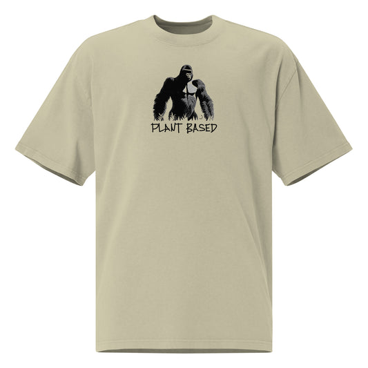 men's oversized t-shirt with a large gorilla standing in jungle flora with the words "plant based" printed underneath, this option is cream and black print